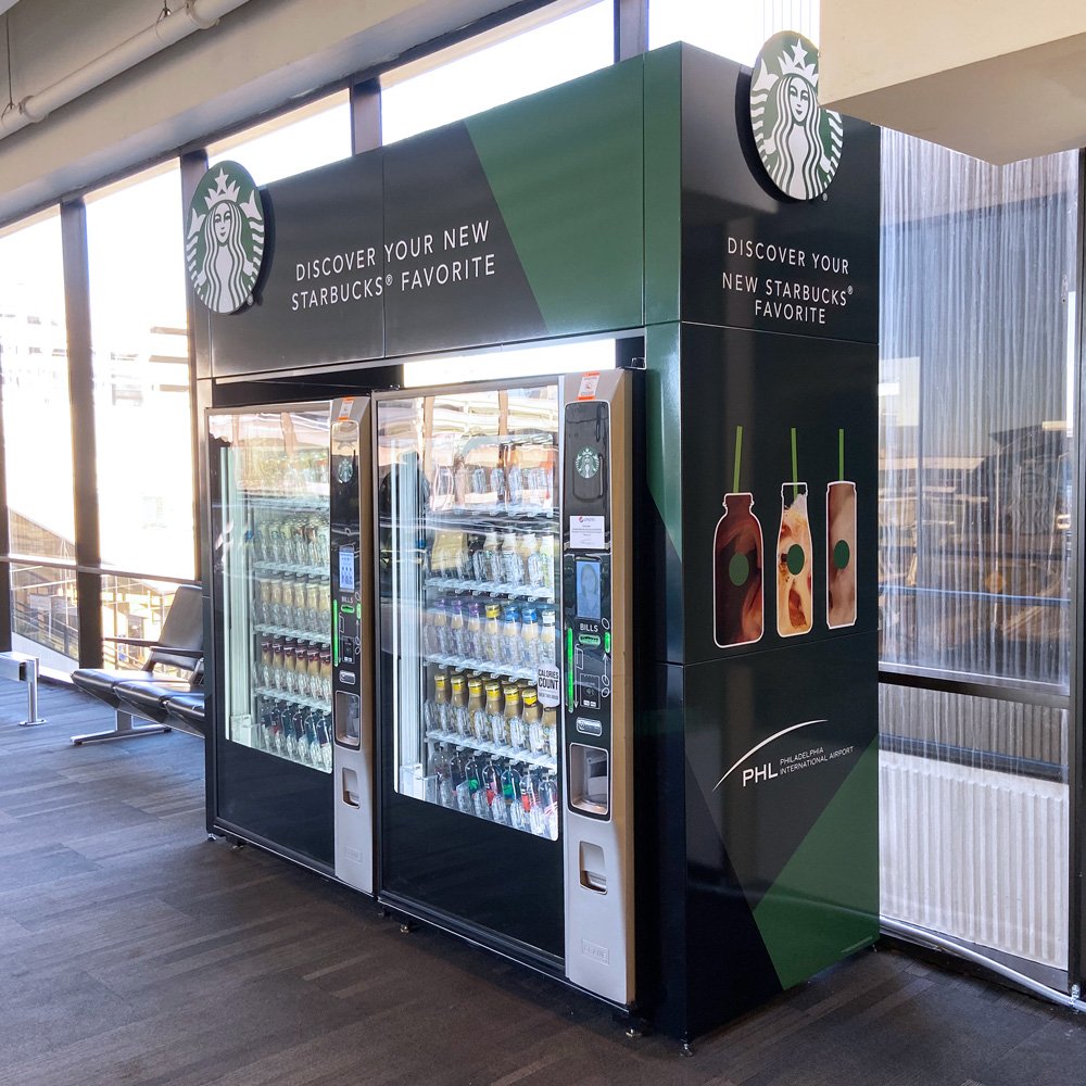 Starbucks vending enclosure beside airport windows